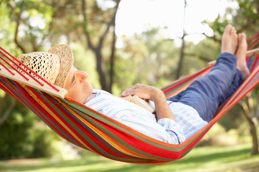 Senior Man Relaxing In Hammock