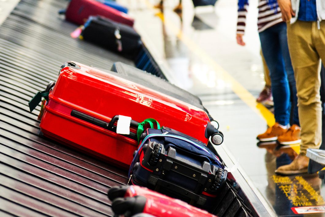 Luggages Moving On Airport Conveyor Belt.