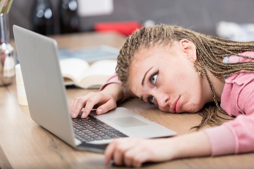 Bored Woman In Front Of Laptop