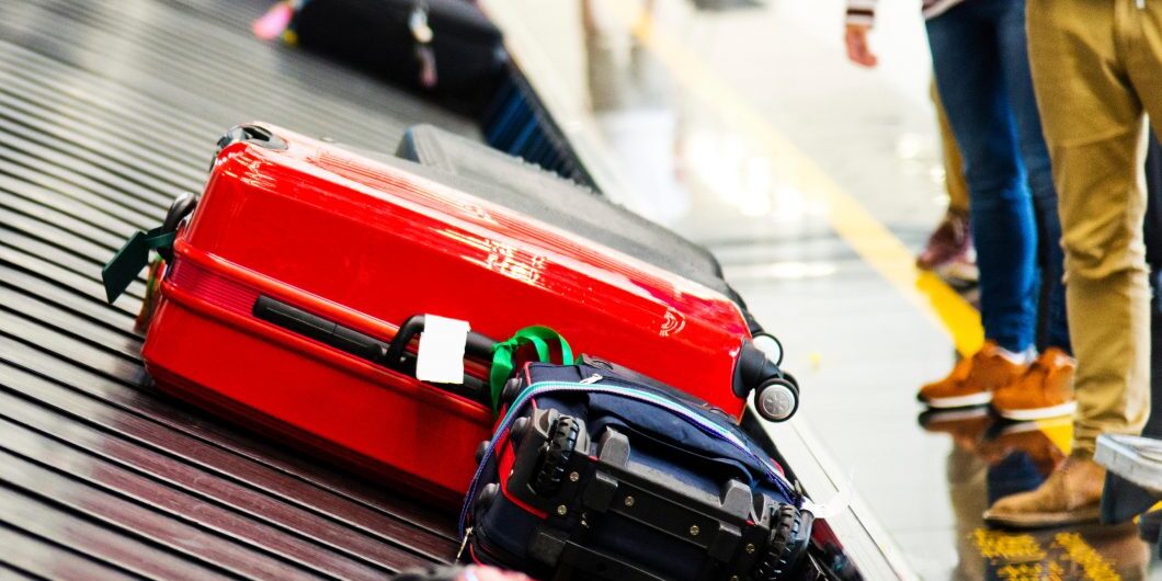 Luggages Moving On Airport Conveyor Belt.