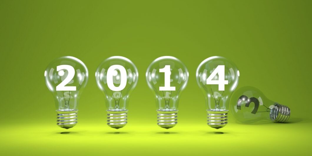 2014 New Year Sign Inside Light Bulbs On Green Background