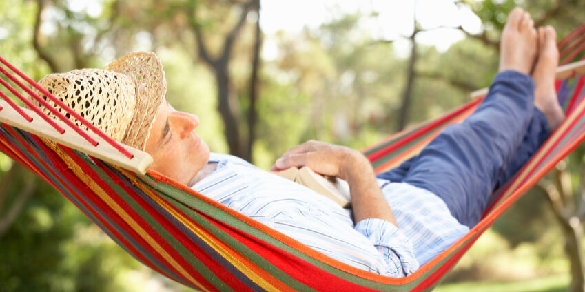 Senior Man Relaxing In Hammock